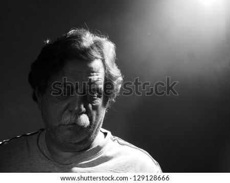 unshavng middle-aged man, black and white
