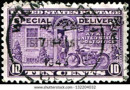 UNITED STATES OF AMERICA - CIRCA 1944: A stamp printed in the USA shows Motorcycle Delivery Special Delivery, circa 1944