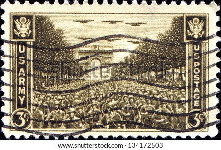 USA - CIRCA 1945: A stamp printed in United States of America shows US Troops Passing Arch Triumph, Paris, circa 1945