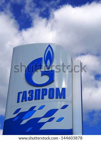 DONETSK - JULY 3, 2013: Gazprom logo against blue sky of July 3, 2013,Donetsk, Rostov Region, Russia. Open Joint Stock Company Gazprom is the largest extractor of natural gas in the world.