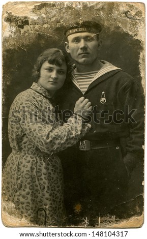 USSR - CIRCA1935 : Vintage photo shows sailor with girl, 1935