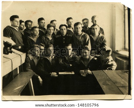SEVASTOPOL, USSR - CIRCA MAY 24, 1948: Vintage photo shows students with the teacher in the office ASW, Sevastopol, May 24, 1948