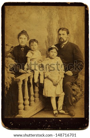 LUGANSK, RUSSIAN EMPIRE - CIRCA 1900s: Studio portrait of family, photo studio by S.Umannsky, Lugansk, Ukraine, 1900s