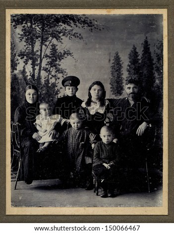 RUSSIAN EMPIRE - CIRCA 1910s: Antique photo shows studio portrait of big Family, 1900s