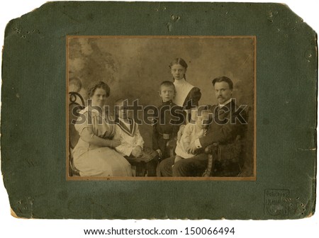 RUSSIAN EMPIRE - CIRCA 1910s: Antique photo shows studio portrait of big Family, photo studio by A. Ivanitsky, Kharkov, Uktraine, 1910s