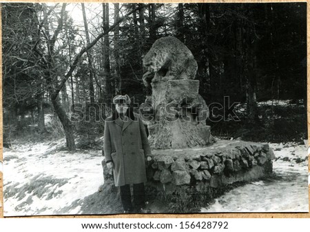 ORSK - CIRCA 1960s: man on the background of the monument of bear, Orsk, Soviet Union, 1960s