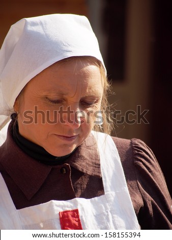 LUGANSK - Oct 13: woman in uniform of nurse of period of World War First. Cossack Historical Club \