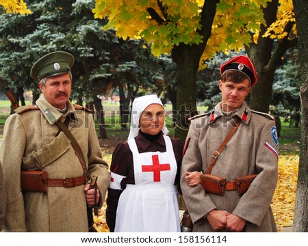 LUGANSK - Oct 13: two cossacs and nurse in the uniform of period of World War First and Russian Civil War. Cossack Historical Club \