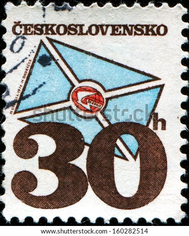 CZECHOSLOVAKIA - CIRCA 1974: A stamp printed in Czechoslovakia honoring Czechoslovak Postal Services, shows P.T.T. emblem within letter , circa 1974