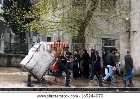 ISTANBUL - Apr 21: man carries a cart with waste paper on the street, on April 21, 2013, Istanbul, Turkey