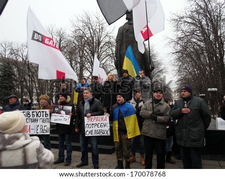 UKRAINE, LUGANSK - JANUARY 5, 2014: Opposition rally in Lugansk. Activists hold placards with slogans such as \