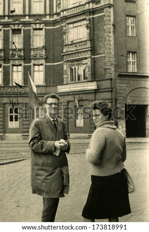 GERMANY, WARON-Muritz - 1950s: An antique photo shows man and woman stay on the street