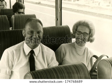 GERMANY -  June 17, 1971: An antique photo shows man and woman sits in the bus