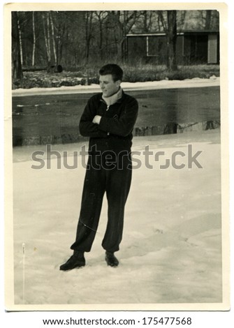 Germany - Circa 1930s: An Antique Photo Shows Man In A Tracksuit Is Standing On A Frozen Lake