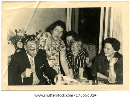 GERMANY -  CIRCA 1960s: An antique photo shows family party