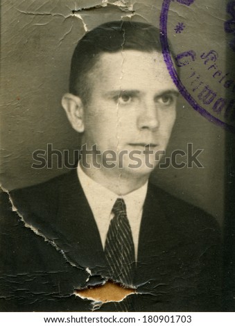 GERMANY - CIRCA 1930s: An antique studio portrait of a middle-aged man in formal suit