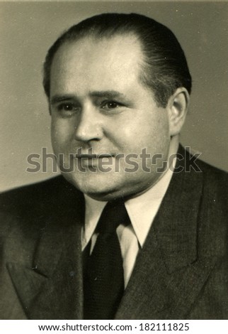 GERMANY - CIRCA 1940s: An antique stadio portrait of middle-aged man in a business suit