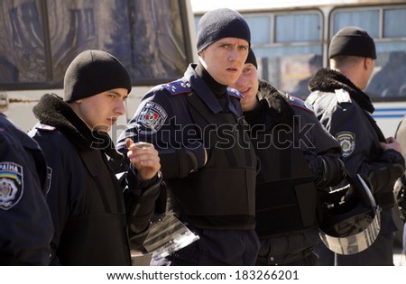 UKRAINE, LIGANSK - MARCH 23, 2014:  Police guard antiwar march. March against the Russian occupation of Crimea held today Luhansk.