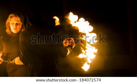 UKRAINE, LUGANSK - March 27, 2014: Lugansk Fire theater  performance in one of the restaurants in the city.