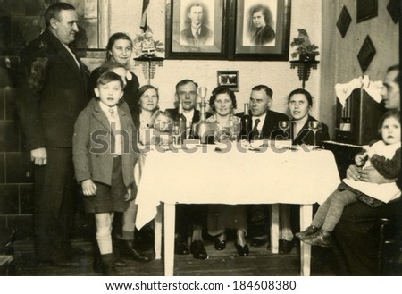 GERMANY  CIRCA 1940s: An antique photo of family party