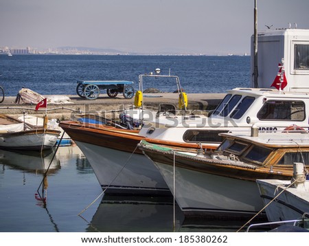 PRINCES ISLANDS, KINALIADA, TURKEY - APRIL 23, 2013: Pleasure boats on the island Kinaliada on background of the Asian part of Istanbul