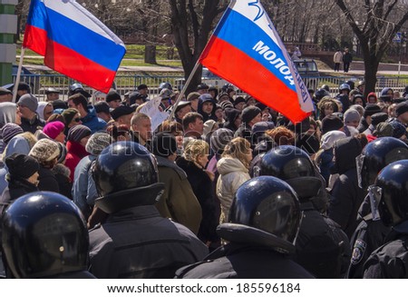 UKRAINE, LUGANSK - April 5, 2014; Pro-Russian activists protests near Regional Office of Security Service of Ukraine. They demanded to give freedom to detainees leaders pro-Russian movement of region