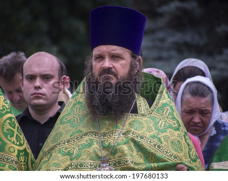 LUHANSK, UKRAINE - June 9, 2014:  Priests pray for peace. Archbishop Luhansk and Alchevsk Mytrofan held prayer for peace in the city center. Hundreds of faithful prayed with him.