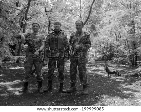METALIST, LUHANSK REGION, UKRAINE June 21, 2014: Pro-Russian fighters posing in the forest near the village of Metalist near Lugansk