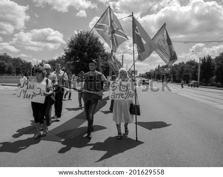 LUHANSK, UKRAINE - June 29, 2014:  Participants in the march of peace require to keep the Donbas children and stop anti-terrorist operation