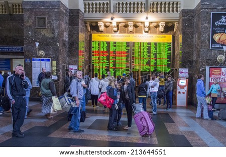 UKRAINE, KYIV - 27 Aug, 2014: Crowd of busy people inside the building of Central Railway Station, Kiev, Ukraine. Kiev\'s Central Railway Station serving 170,000 passengers per day.