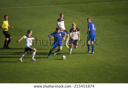 UKRAINE, KYIV - September 6, 2014:  In a friendly match of pop stars, movies stars, businessmen,and members of the Military Forces of Ukraine