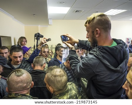 UKRAINE, KYIV - September 26, 2014: Journalists filming the conflict between Maidan and former employees \