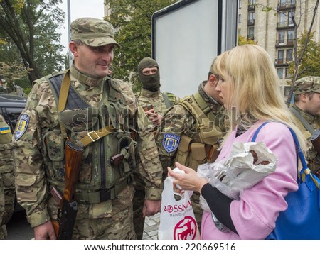 UKRAINE, KYIV - September 30, 2014: Woman brought medicines and food to soldiers. -- From Kiev to the war zone went advance party of the battalion of special purpose \