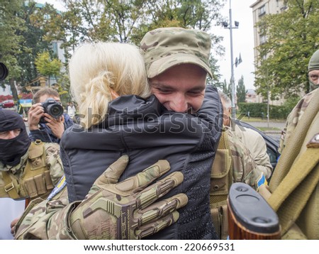 UKRAINE, KYIV - September 30, 2014: Irina Fahrion sees off in the war zone of his friend. -- From Kiev to the war zone went advance party of the battalion of special purpose \