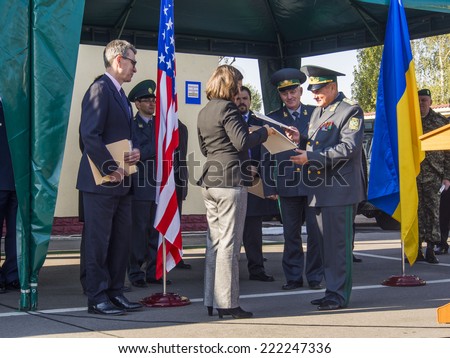 KIEV , UKRAINE - October 8, 2014: Official authorized State Department for European and Eurasian Affairs Victoria Nuland gave Ukrainian border guards vehicles and equipment for arrangement of border