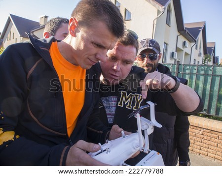 KIEV , UKRAINE - October 10, 2014: Avtomaydan leader Sergei Koba filming residence Attorney General by a drone. -- Avtomaydan activists visited the estate of the Prosecutor General Vitaly Yarema