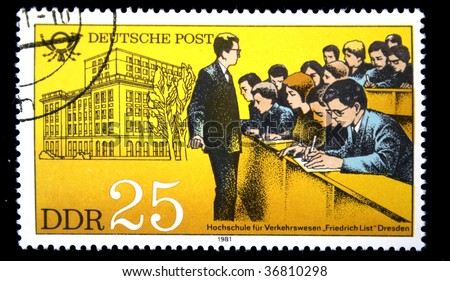German Democratic Republic - CIRCA 1981: A stamp printed in GDR shows building of school, an audience with students and the teacher, one stamp from series devoted Training of personnel , circa 1981