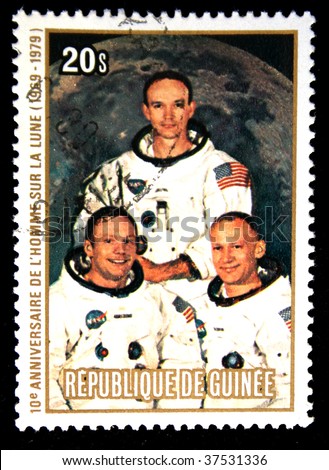 Republic of Guinea - CIRCA 1979: A stamp printed in Republic of Guinea honoring Apollo moon program, shows NASA photo of team Apollo-11, one stamp from series, circa 1979.