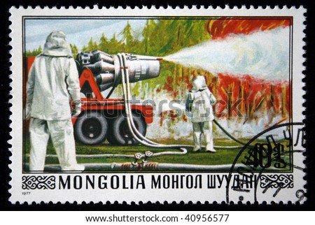 MONGOLIA- CIRCA 1977: A stamp printed in Mongolia shows firefighters extinguish forest, series, circa 1977