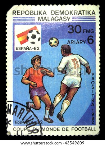 REPULLICA MALAGASY - CIRCA 1982: A stamp printed in Malagasy (Madagascar) shows image of a football (soccer) player, series, circa 1982