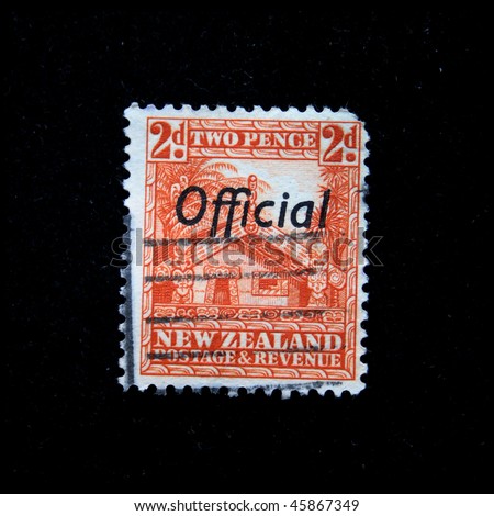 NEW ZEALAND - CIRCA 1931-1944: A stamp printed in New Zealand shows totem carved Maori house, circa 1931-1944