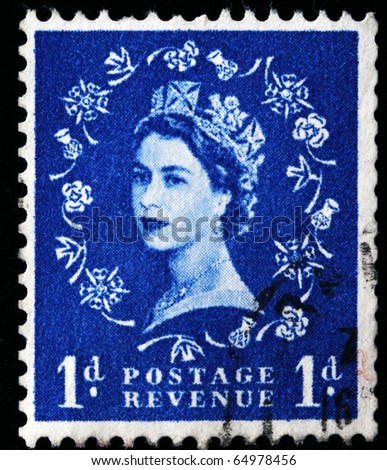 UNITED KINGDOM - CIRCA 1970: An English Used First Class Postage Stamp showing Portrait of Queen Elizabeth II in blue, circa 1970