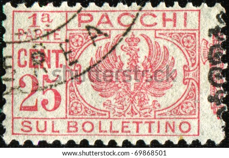 ITALY - CIRCA 1930: Postage stamps for packets and parcels. Was released in Italy on Dec. 22, 1930 and used until 31 December 1948. This photo shows half affixed to the parcel, circa 1930.