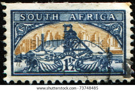 OUTH AFRICA - CIRCA 1941: A stamp printed in South Africa shows Gold Mine Bilingual pair, circa 1941