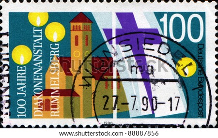 GERMANY - CIRCA 1988: A stamp printed in German Federal Republic honoring Centenary of Rummelsberg Diaconal Institution, shows St Philip\'s Church, Protestant Church Flag and Candle Flames, circa 1988