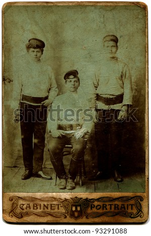 RUSSIA - CIRCA end of the XIX - the beginning of XX century: three boys in service caps, the Russian Empire, end of the XIX - the beginning of XX century