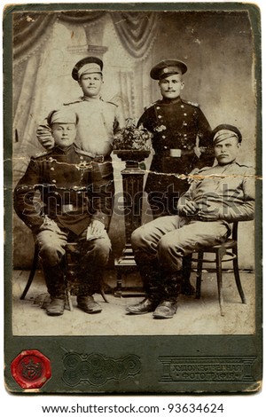 RUSSIA - CIRCA  period of the First World War: An antique photo shows four soldiers, the Russian Empire, period of the First World War Russian text: Art photography