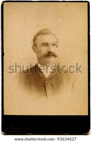 RUSSIA - CIRCA 1889: An antique photo shows man with a mustache, Kursk, the Russian Empire, 1889 Russian text: Nuzhdenko (photographer), Kursk
