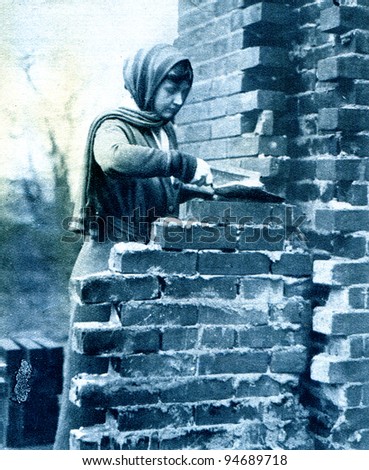 Bricklayer\'s labourer in an English village - photo from \