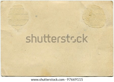 yellowed paper of back side of postcard